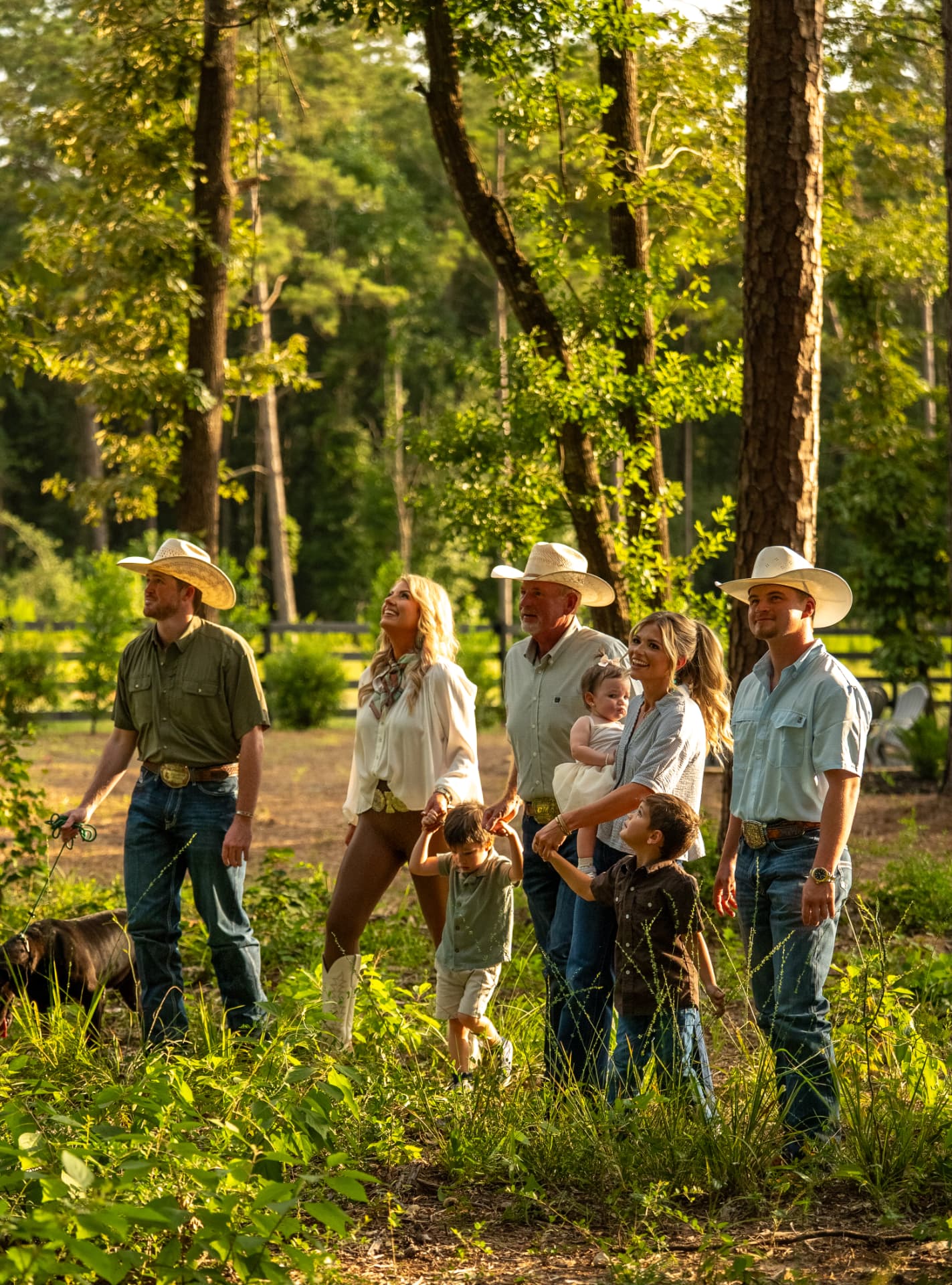 Lifestyle shoot photo of a multigenerational ranch family exploring their wooded land, directed and produced by Toni Bubb for Patten Properties